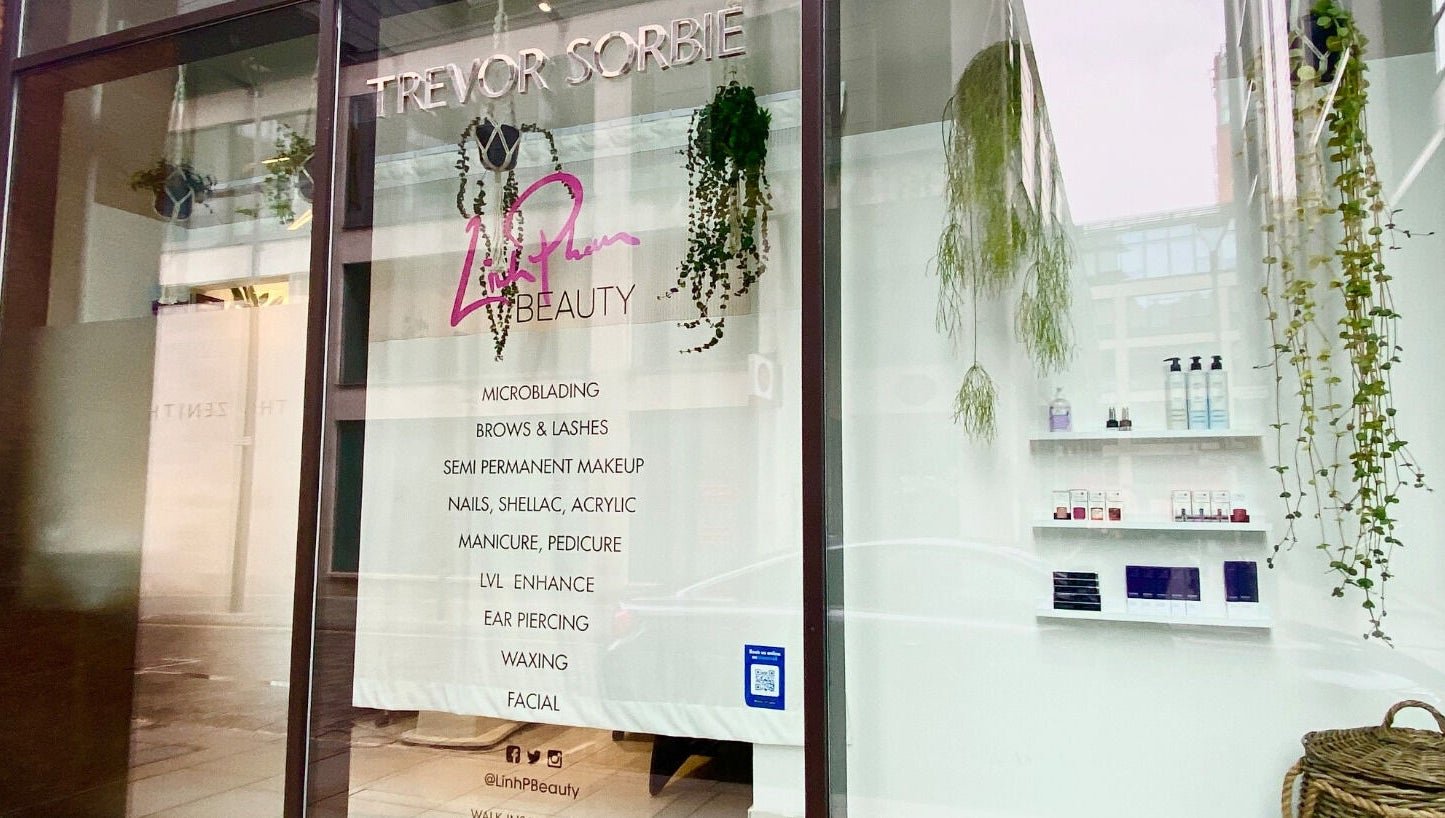 The Linh Beauty sign in the Trevor Sorbie salon window on Spring Gardens